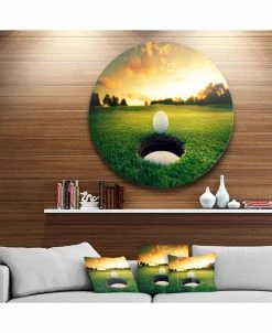 Design Art Art 'Golf Ball Near Hole' Landscape Metal Circle Wall Art - 36 X 36